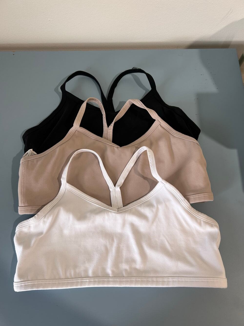 Athleta girl set of 3 All Day bralettes size XXL/16 white tan black